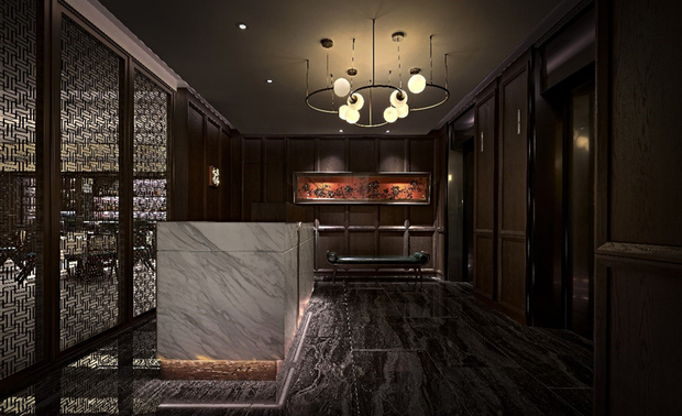 
本文由OPEN编辑部撰写

设计概念　Design Concept

由浅白色系的饭店大厅乘搭电梯，仅是数秒间的楼层转换，便抵达二十世纪初期的上海──眼前，天壁精緻球型吊灯摇曳柔光，洒落一派清幽，伴随地坪富丽石纹、壁面深沉木韵的谧静雍雅，开展现代交融復古的对比趣味；优美大气的迎宾氛围萦绕身侧，恍惚间，宛如踏入热闹迷人、而又似虚若实的异国租界中……

呼应商空主打的粤菜佳餚，以及品牌名中的「红楼」二字，简兆芝室内设计 简兆芝 主持设计师 由经典文学《红楼梦》之章节〈寿怡红群芳开夜宴〉发想，将宴中高朋满座、人来人往的欢笑画面，与调和多元文化的老上海风格重叠，以昏黄朦胧的微光，烘托木皮、藤编、凋纹屏风等中式元素，佐搭线板、镀钛铁件及各式灯具，造就东西合璧的繁华宴景，赋予访客重返1920年代十里洋场般的沉浸体验，也透过异材展显古今并存的溷搭美感，象徵餐厅持续创新怀旧餐点的经营理念。

An elevator swiftly transports one from the light-hued hotel lobby to early 20th-century Shanghai. Delicate sphere pendant lights elegantly greet guests, casting a gentle glow that enhances the serene ambiance. The exquisite stone-patterned flooring and richly textured dark wood walls create a sophisticated contrast, harmoniously blending modern elements with vintage charm. This graceful and welcoming environment evokes the allure of the bustling, enchanting Shanghai International Settlement, enveloping guests in a timeless and immersive experience.

Paying homage to the rich tapestry of Cantonese cuisine and the evocative name Red Chamber, INK DESIGN SPACE's presiding designer Kathy Chien drew inspiration from the iconic literary chapter “The Night of the Grand Feast in the Happy Red Court” in Dream of the Red Chamber. This scene, filled with laughter and mingling guests, seamlessly merges with the old Shanghai style and diverse cultures, characterized by dim, ambient lighting that delicately accentuates traditional Chinese elements such as wood veneers, rattans, and intricately carved screens. These are gracefully paired with molding, titanium-plated ironworks, and an array of light fixtures, creating a luxurious banquet setting that embodies a harmonious blend of Eastern and Western aesthetics. This design invites guests to immerse themselves in the vibrant experience of 1920s Shanghai, while the eclectic mix of materials symbolizes the restaurant’s dedication to innovating nostalgic cuisine.

设计手法　Design Techniques

巧运软装 形塑百变风貌
Crafting Versatile Ambiances Through Skillful Soft Furnishing

本案採用团队过去少用的软装核心设计，藉由佈置迥异材质、花纹的家具软件、装饰画作、图样壁纸，实现復古上海风兼容并蓄的多样艺韵，搭配各场域皆异的造型主灯、周围可多段式调节的照明，构筑早期室内灯光微暗的质感享食情境。

This project introduces a core soft furnishing design rarely used by the team, artfully arranging various furnishings with contrasting materials, patterns, and decorative elements. This approach brings to life the eclectic artistic essence of the old Shanghai style, harmoniously blending diverse influences. Complementing this are unique statement light fixtures in each area, paired with adjustable ambient lighting, creating a dining environment that evokes the subtle, dimly lit interiors of the early 20th century.

思量需求 安排适切动线
Thoughtful Consideration of Requirements and Flow

考量外场接待迎宾、内场出餐所需，分别规划员工、饭店客人和办公室商务通道三条动线，避免服务生出入厨房时与宾客入座路径冲突，同时顾及内部酒吧开张时段，入夜后可将通往共享办公室的路线关闭，仅保留一处访客出入口，提升餐厅整体安全性。


Considering the needs of front-of-house reception and back-of-house service, three carefully planned pathways offer smooth flow: one for staff, one for hotel guests, and one for business office access. This thoughtful arrangement prevents conflicts between servers entering the kitchen and guests finding seats. Additionally, the design accommodates the bar’s operational hours by enabling the closure of the route to the shared office space at night, leaving a single entrance for guests, thereby significantly enhancing the overall security of the restaurant.

重视环保 延循旧有硬装
Emphasizing Sustainability with Retained Hard Furnishings

此案保留案场原有的隔间、地坪及平面天花板等硬体装潢，降低重新装修造成的材料耗损和废料产生，改以软装为主的手法也利于日后因应饭店内装更动、时代潮流变迁，仅需更新软件摆设即可轻鬆营造崭新氛围，达至环保永续的目的。

We preserved the existing partitions, flooring, and flat ceilings to minimize material waste and reduce the environmental impact of this renovation project. By focusing primarily on soft furnishing, the design allows for effortless updates in response to changes in the interior design or evolving trends, requiring only the replacement of soft furnishings to create a refreshing, welcoming ambiance. This approach aligns with the principles of environmental sustainability and long-term conservation.
