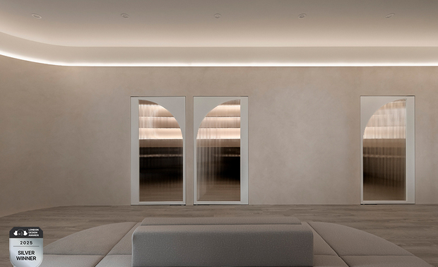 ▲等待区前区透过浅绿柜身与深绿沙发的色调层次变化，映照宛如温煦日光的间接照明，营造天空下的生机盎然，象徵希望之芽的孕育与绽放；后方区域则以大面积圆弧牆铺叙和煦大地色，牆面上方悬挂一道流线型光带，宛若母亲充满爱意的臂弯，拥抱每一稚嫩的孩子。
