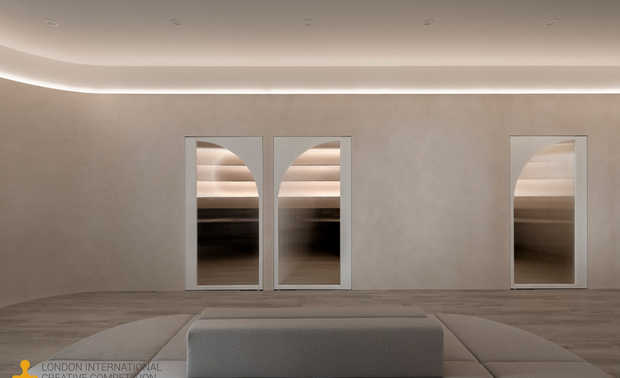 ▲等待区前区透过浅绿柜身与深绿沙发的色调层次变化，映照宛如温煦日光的间接照明，营造天空下的生机盎然，象徵希望之芽的孕育与绽放；后方区域则以大面积圆弧牆铺叙和煦大地色，牆面上方悬挂一道流线型光带，宛若母亲充满爱意的臂弯，拥抱每一稚嫩的孩子。
